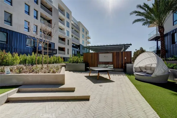 a view of a swimming pool and an outdoor seating