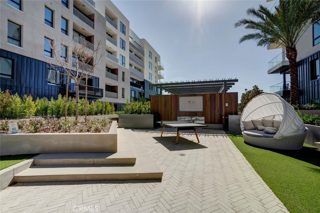 1306 Rivington Irvine, CA 92612 - Photo 42 of 75 a view of building with outdoor seating and entertaining space