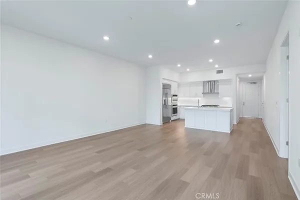 a kitchen that has a sink and a stove in it