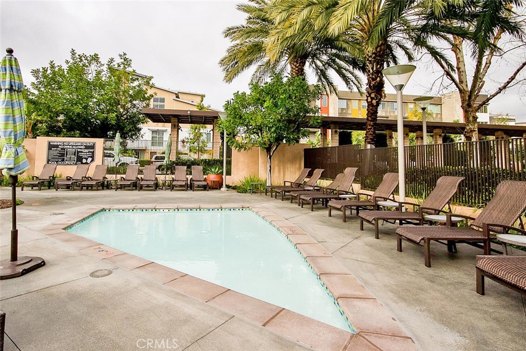 1306 Rivington Irvine, CA 92612 - Photo 62 of 75 a view of a swimming pool with chairs
