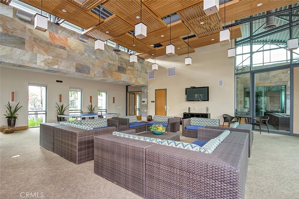 1306 Rivington Irvine, CA 92612 - Photo 72 of 75 a living room with granite countertop couches a fireplace with wooden floor and furniture