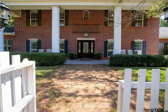 a view of a lake with a yard