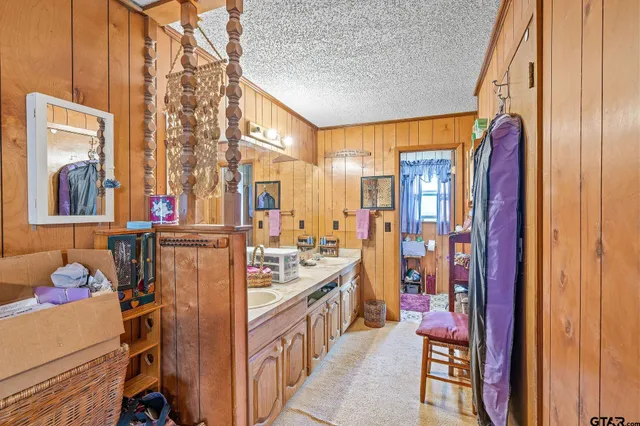 a view of a living room with furniture and a large window