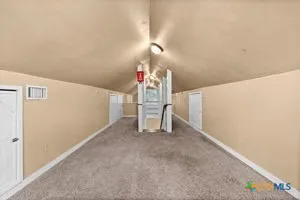 a view of a livingroom with stairs