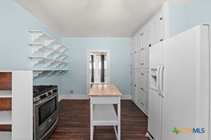 1825 Hruskaville Road Temple, TX 76501 - Photo 5 of 15 a kitchen with stainless steel appliances a stove top oven and a refrigerator