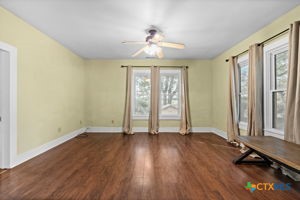 1825 Hruskaville Road Temple, TX 76501 - Photo 6 of 15 an empty room with wooden floor and windows