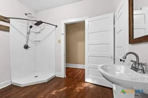 a bathroom with a sink and a mirror