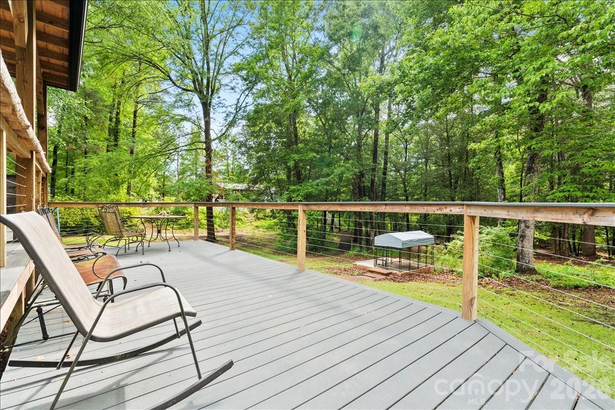 209 Fairway Road Cheraw, SC 29520 - Photo 31 of 48 a view of sitting space and deck with wooden floor and fence