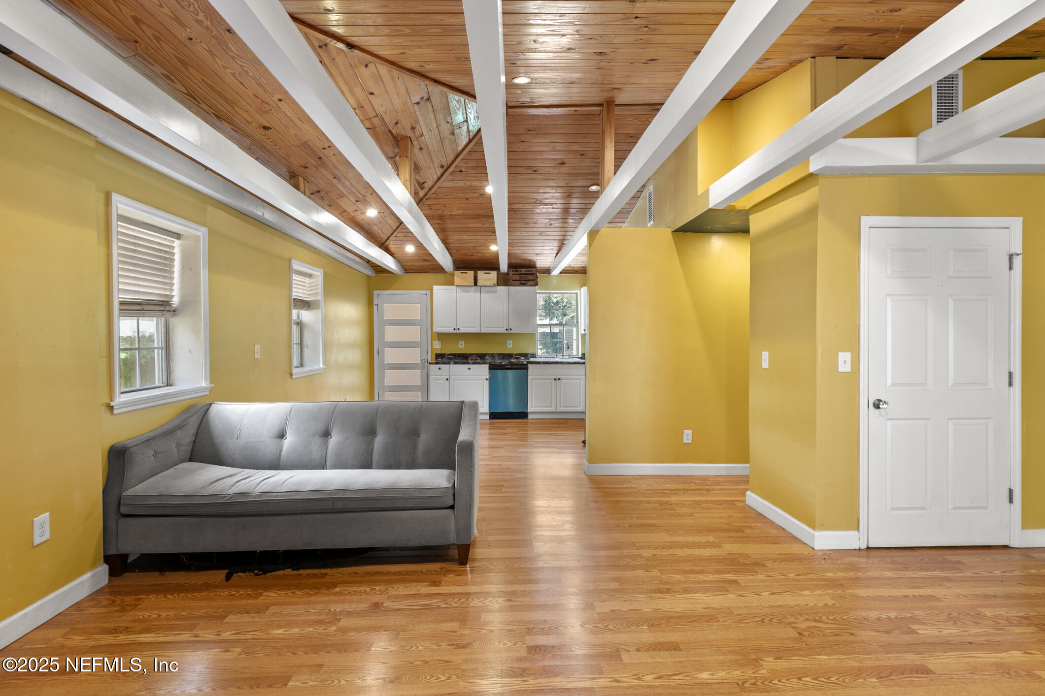 111 Palmer Street St. Augustine, FL 32084 - Photo 22 of 59 a living room with furniture and a chandelier