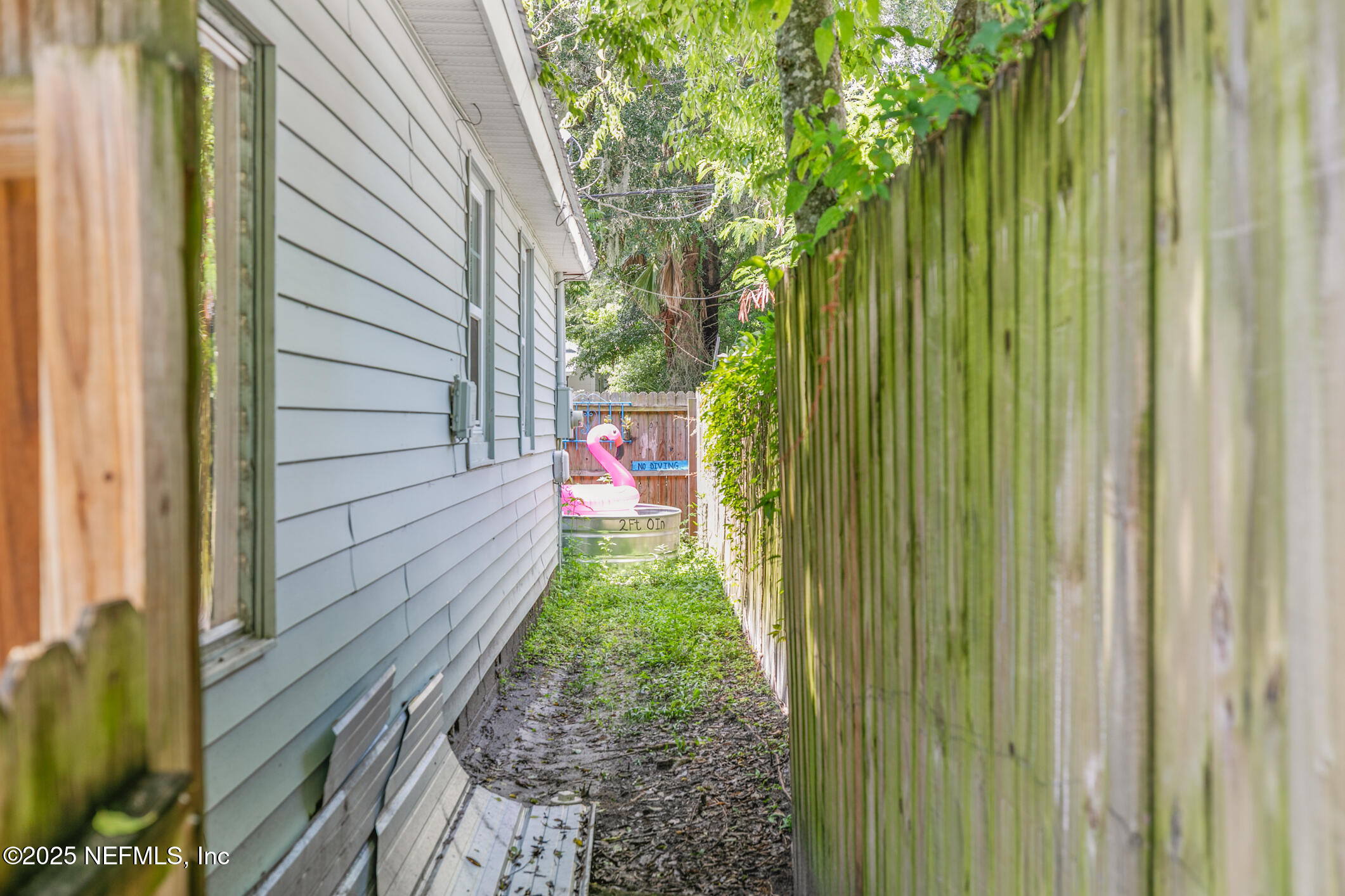 111 Palmer Street St. Augustine, FL 32084 - Photo 47 of 59 a backyard of a house with outdoor seating
