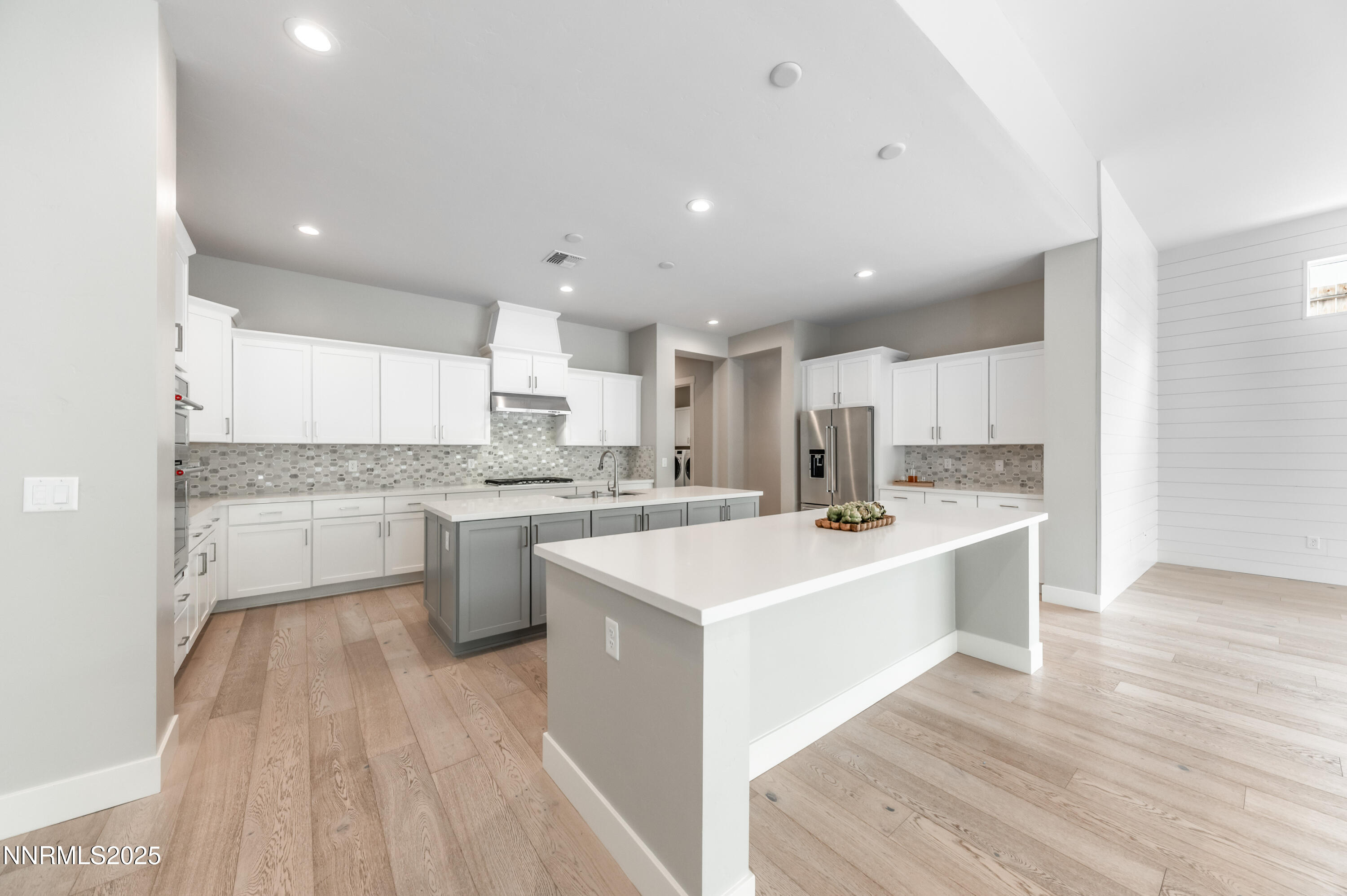 3034 Copper Stone Drive Reno, NV 89521 - Photo 13 of 24 a kitchen with a sink stainless steel appliances and white cabinets