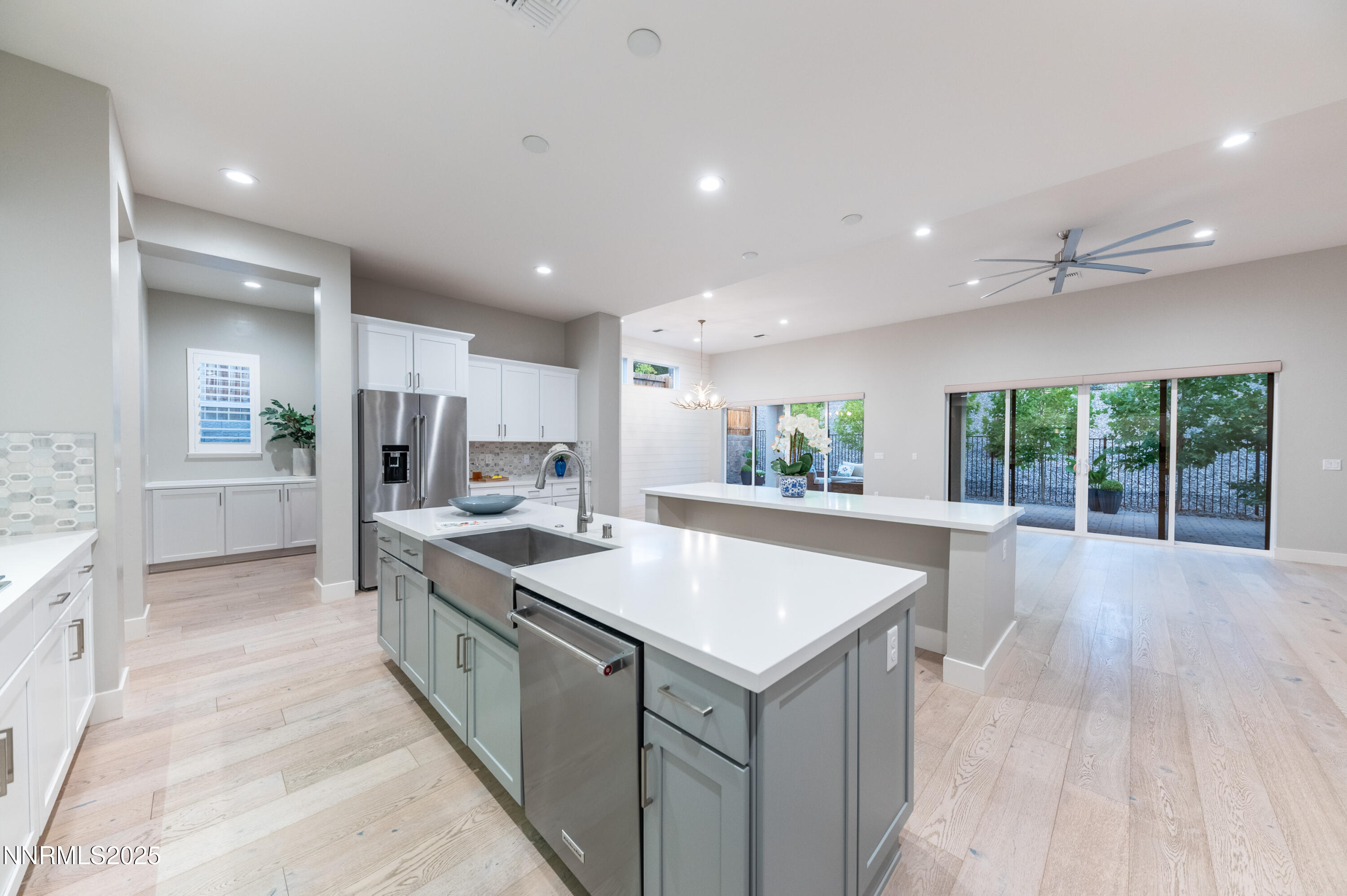 3034 Copper Stone Drive Reno, NV 89521 - Photo 14 of 24 a large kitchen with kitchen island a sink stainless steel appliances and a counter top space
