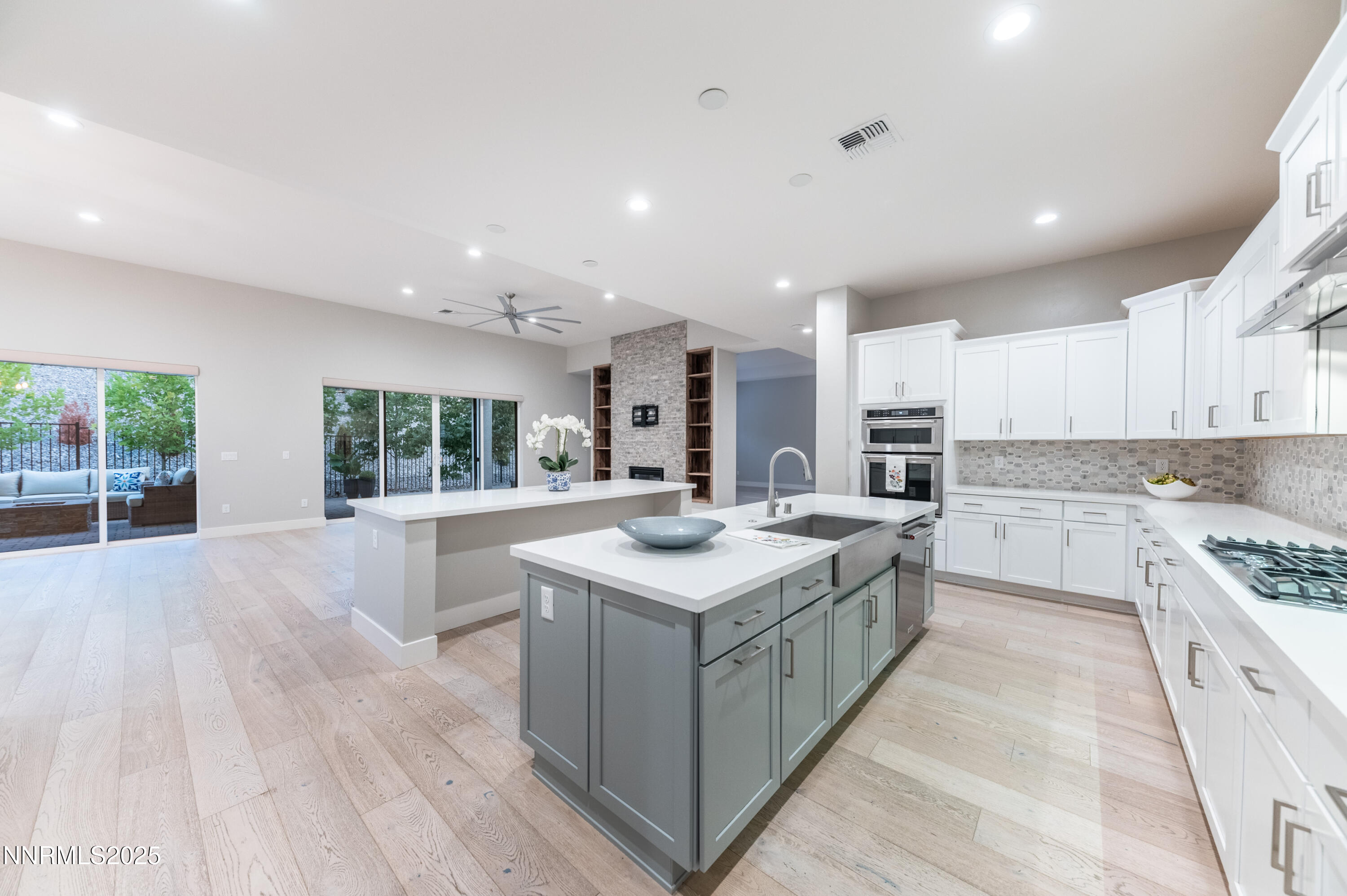 3034 Copper Stone Drive Reno, NV 89521 - Photo 15 of 24 a kitchen with stainless steel appliances granite countertop a sink and a stove