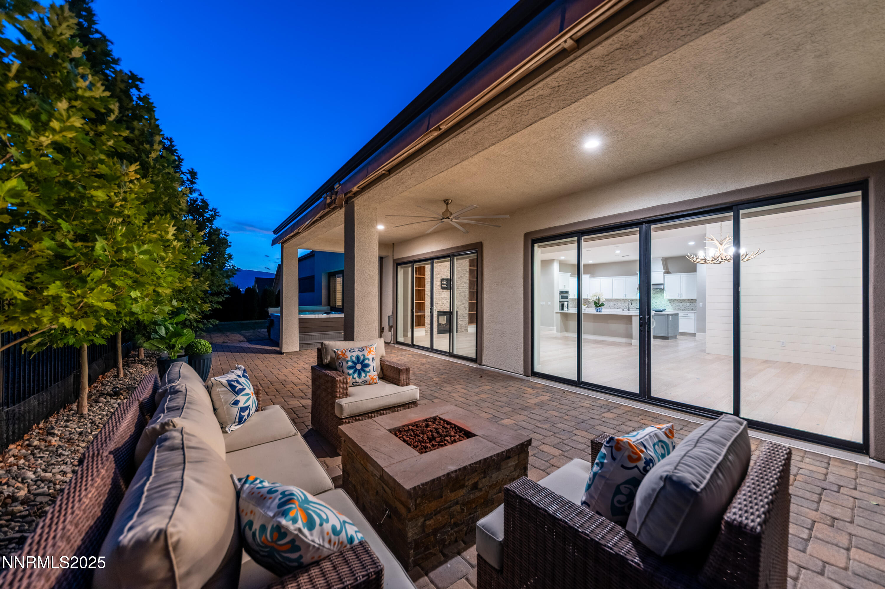 3034 Copper Stone Drive Reno, NV 89521 - Photo 20 of 24 a living room with furniture and a floor to ceiling window