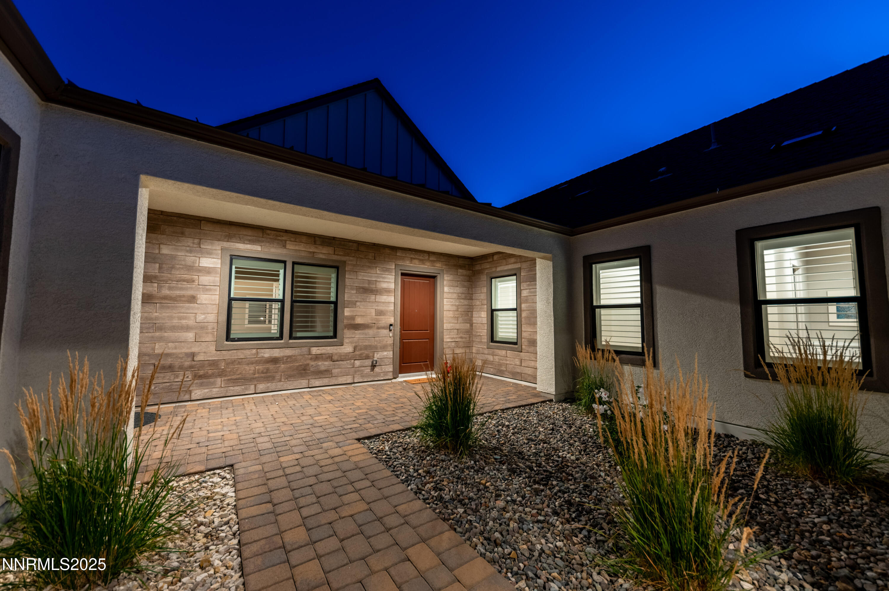 3034 Copper Stone Drive Reno, NV 89521 - Photo 4 of 24 a front view of a house with garden