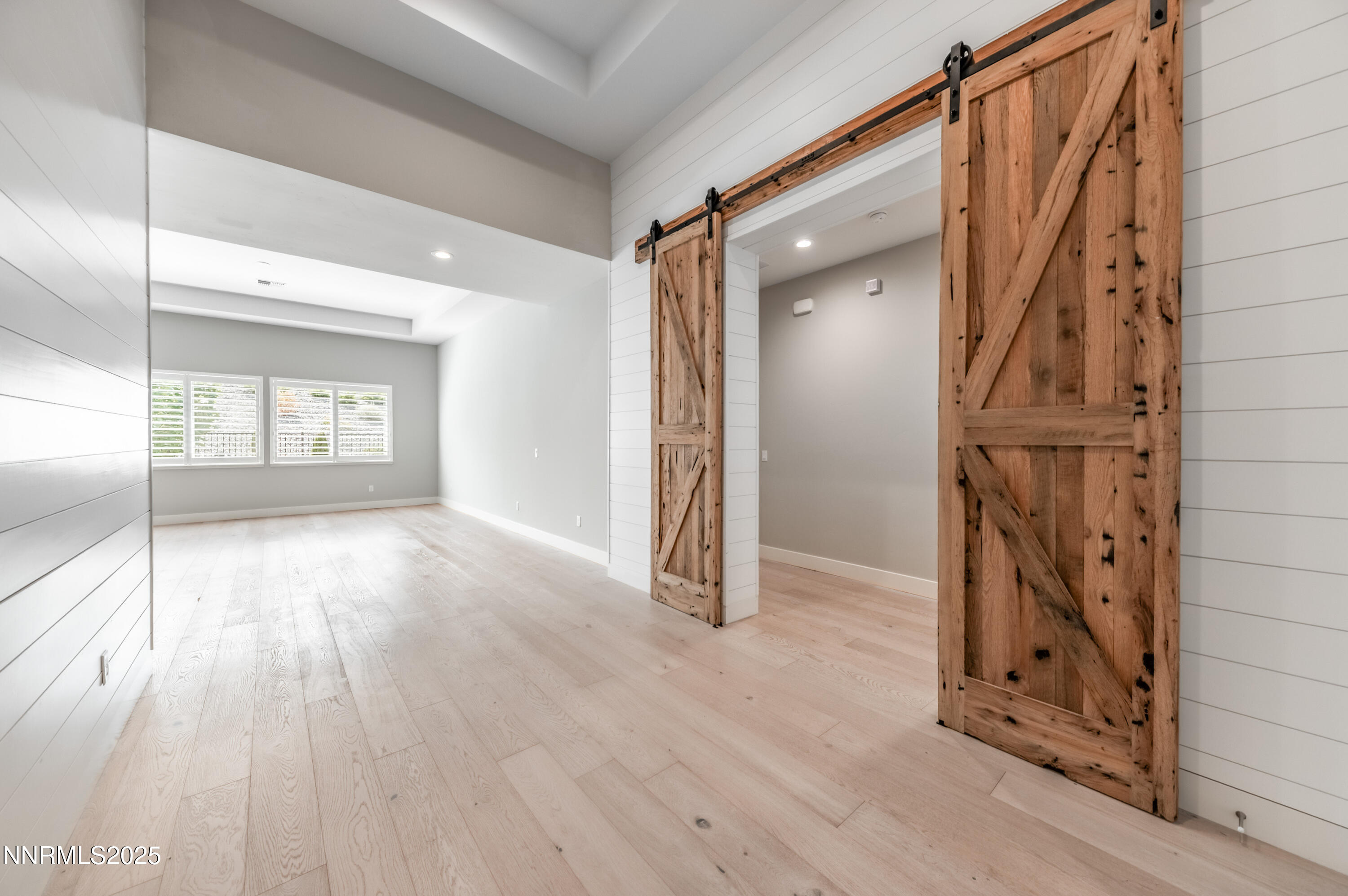 3034 Copper Stone Drive Reno, NV 89521 - Photo 6 of 24 a view of empty room with wooden floor and fan