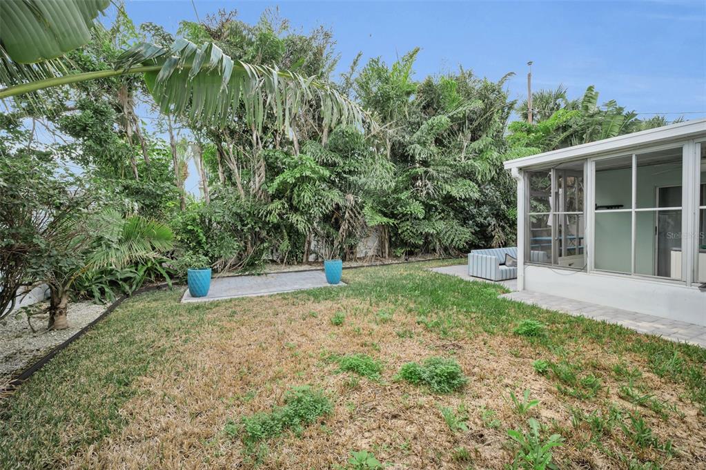 15812 3rd Street East Redington Beach, FL 33708 - Photo 11 of 19 a view of a house with backyard and garden