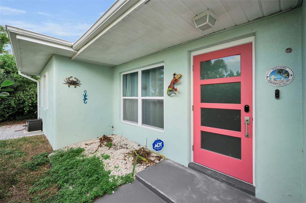 15812 3rd Street East Redington Beach, FL 33708 - Photo 6 of 19 a front view of a house with an outdoor space