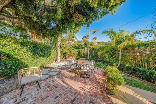 a view of a chairs and table in patio