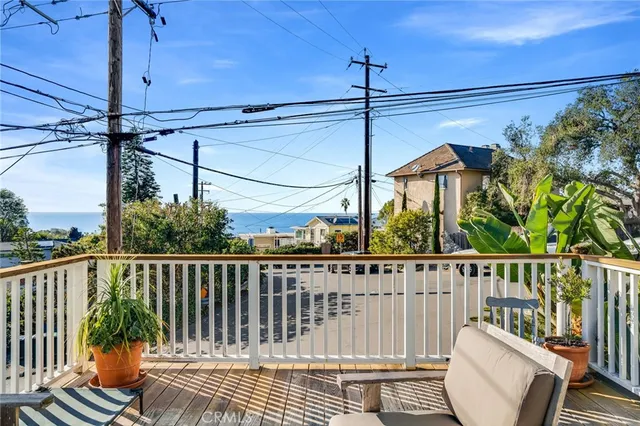 a view of a chair and table in the balcony