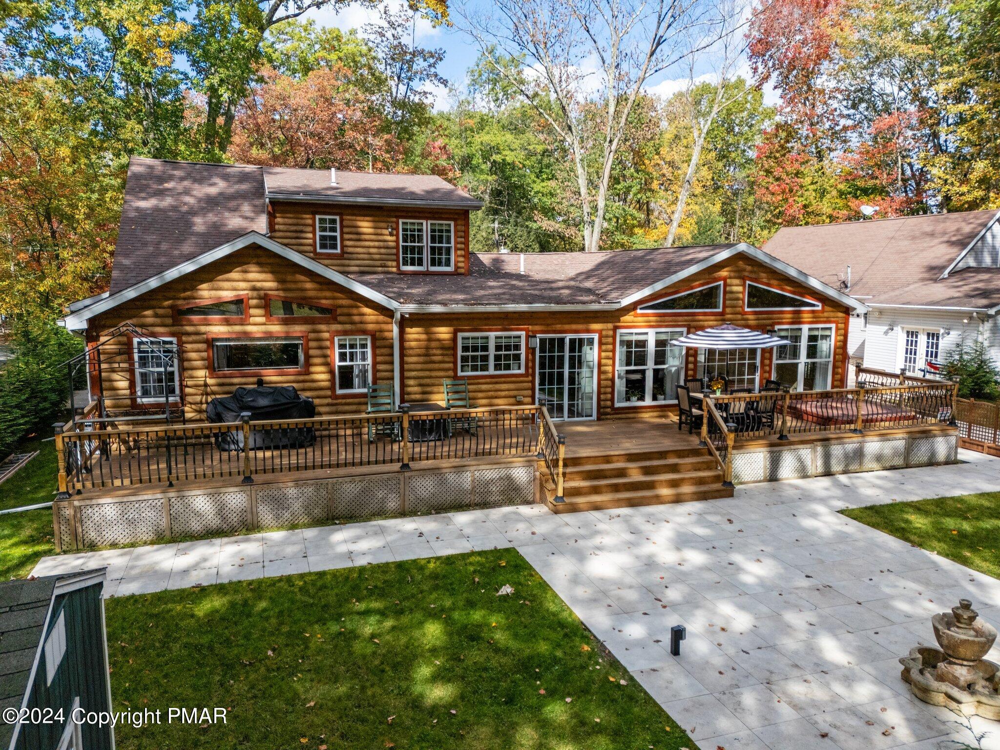 271 4 Seasons Drive Drums, PA 18222 - Photo 11 of 74 a front view of a house with a yard table and chairs