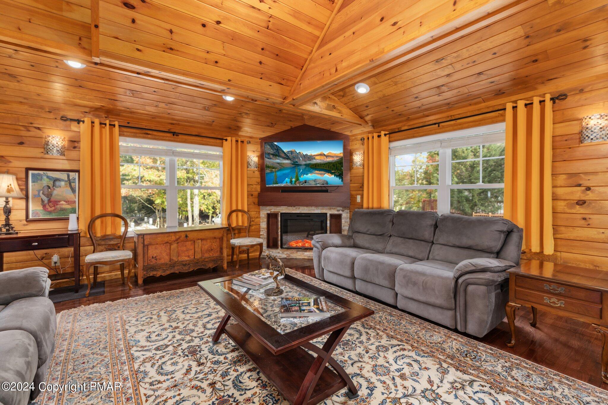 271 4 Seasons Drive Drums, PA 18222 - Photo 20 of 74 a living room with furniture a fireplace and a table