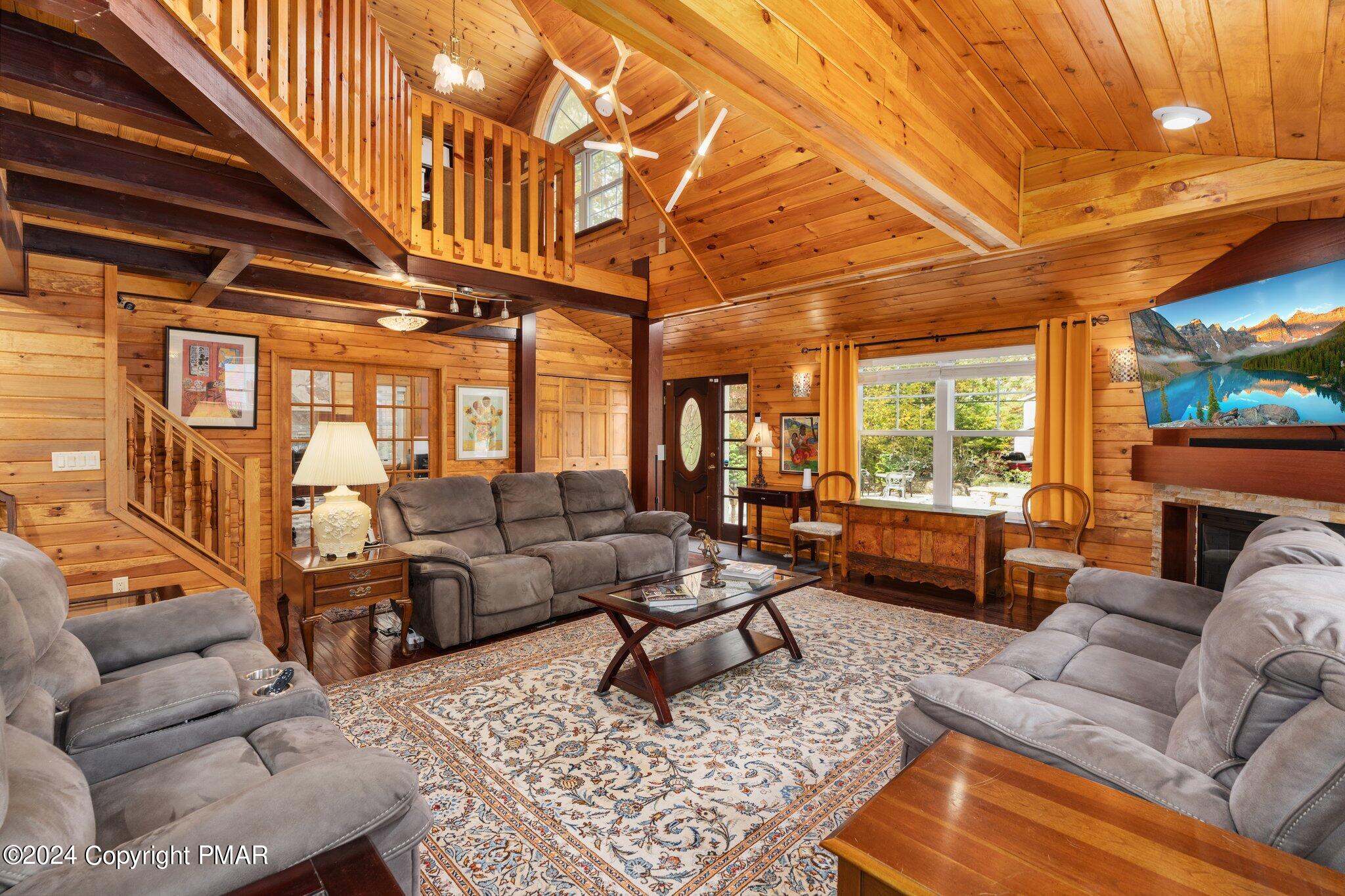 271 4 Seasons Drive Drums, PA 18222 - Photo 22 of 74 a living room with furniture a rug and a large window