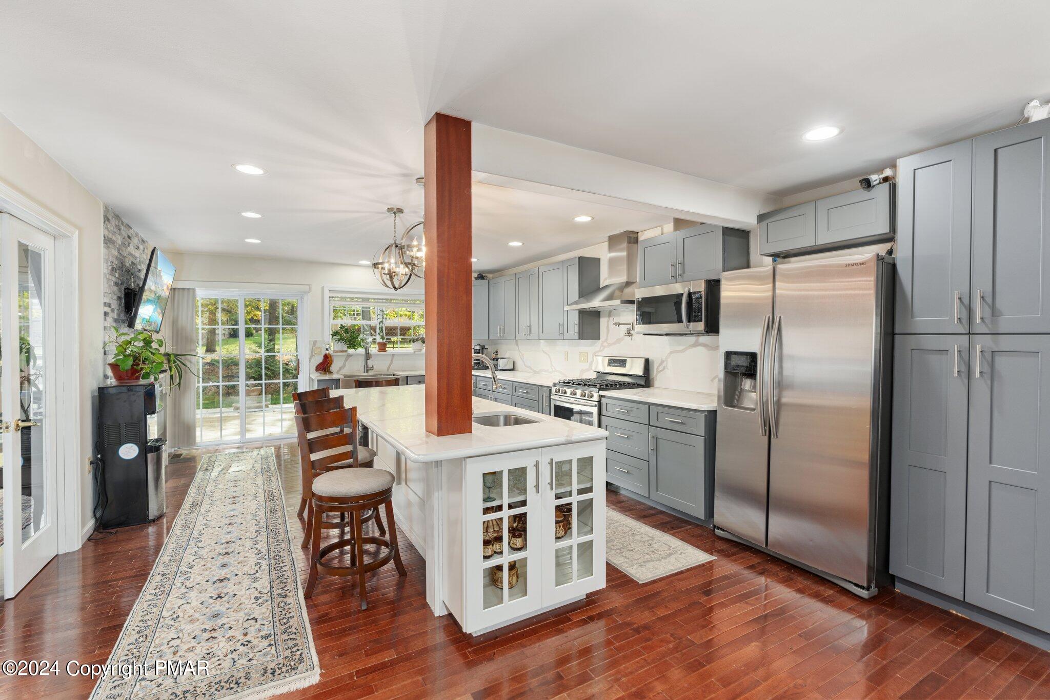 271 4 Seasons Drive Drums, PA 18222 - Photo 29 of 74 a kitchen with stainless steel appliances granite countertop a refrigerator a stove and a wooden floors