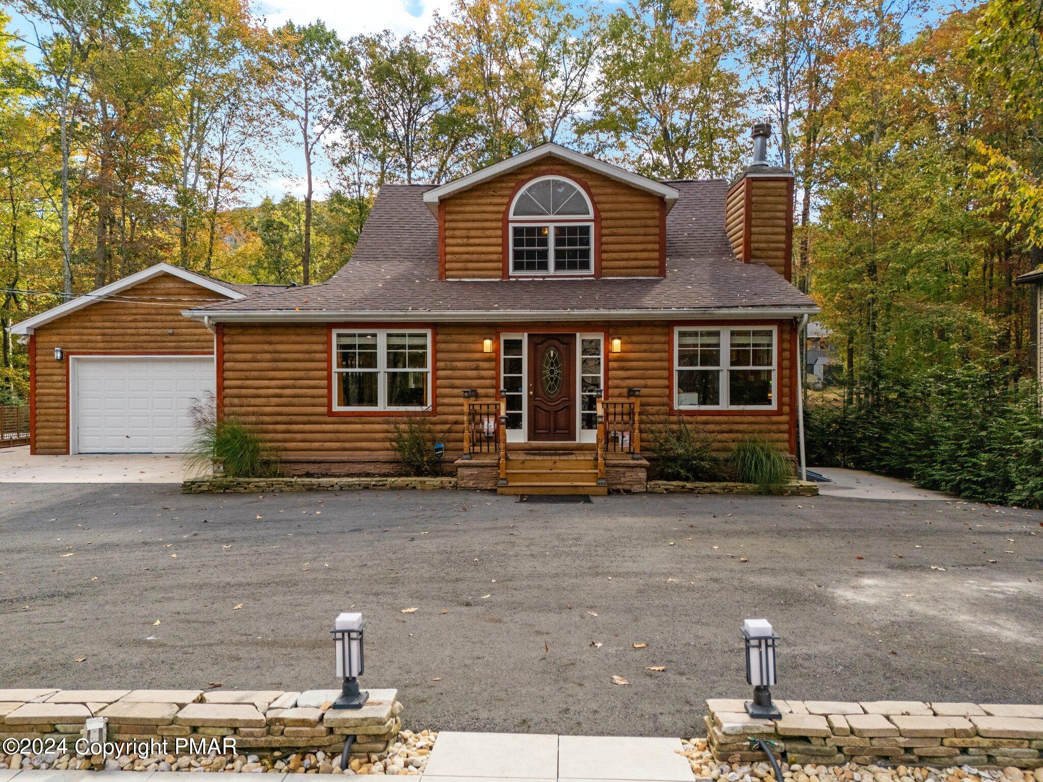271 4 Seasons Drive Drums, PA 18222 - Photo 3 of 74 a front view of a house with a garage