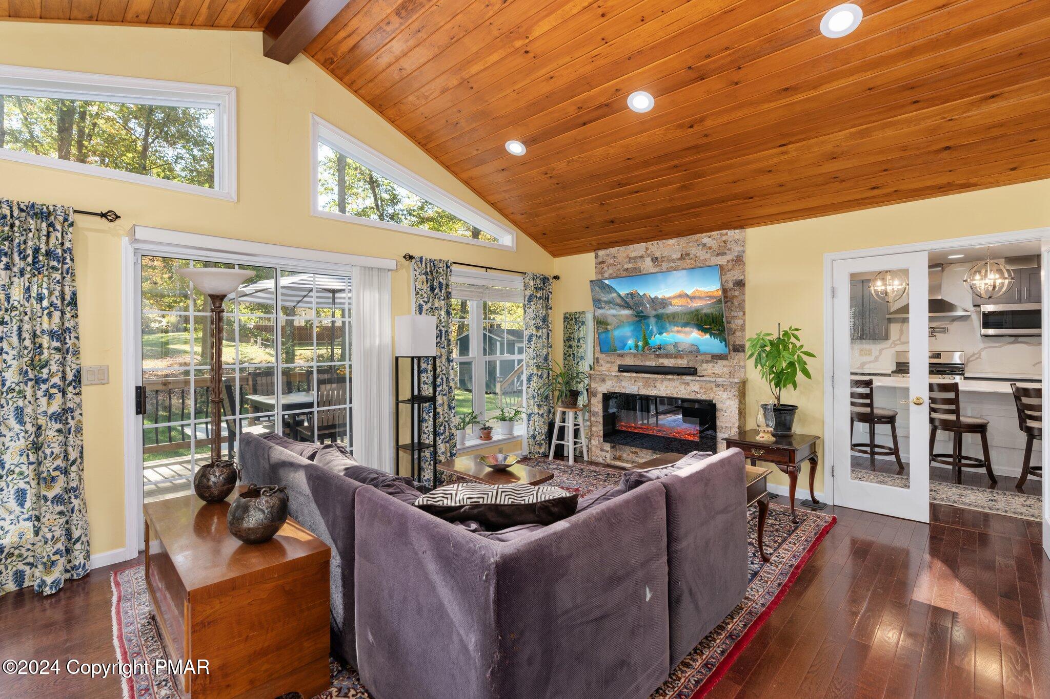 271 4 Seasons Drive Drums, PA 18222 - Photo 38 of 74 a living room with fireplace furniture and a floor to ceiling window