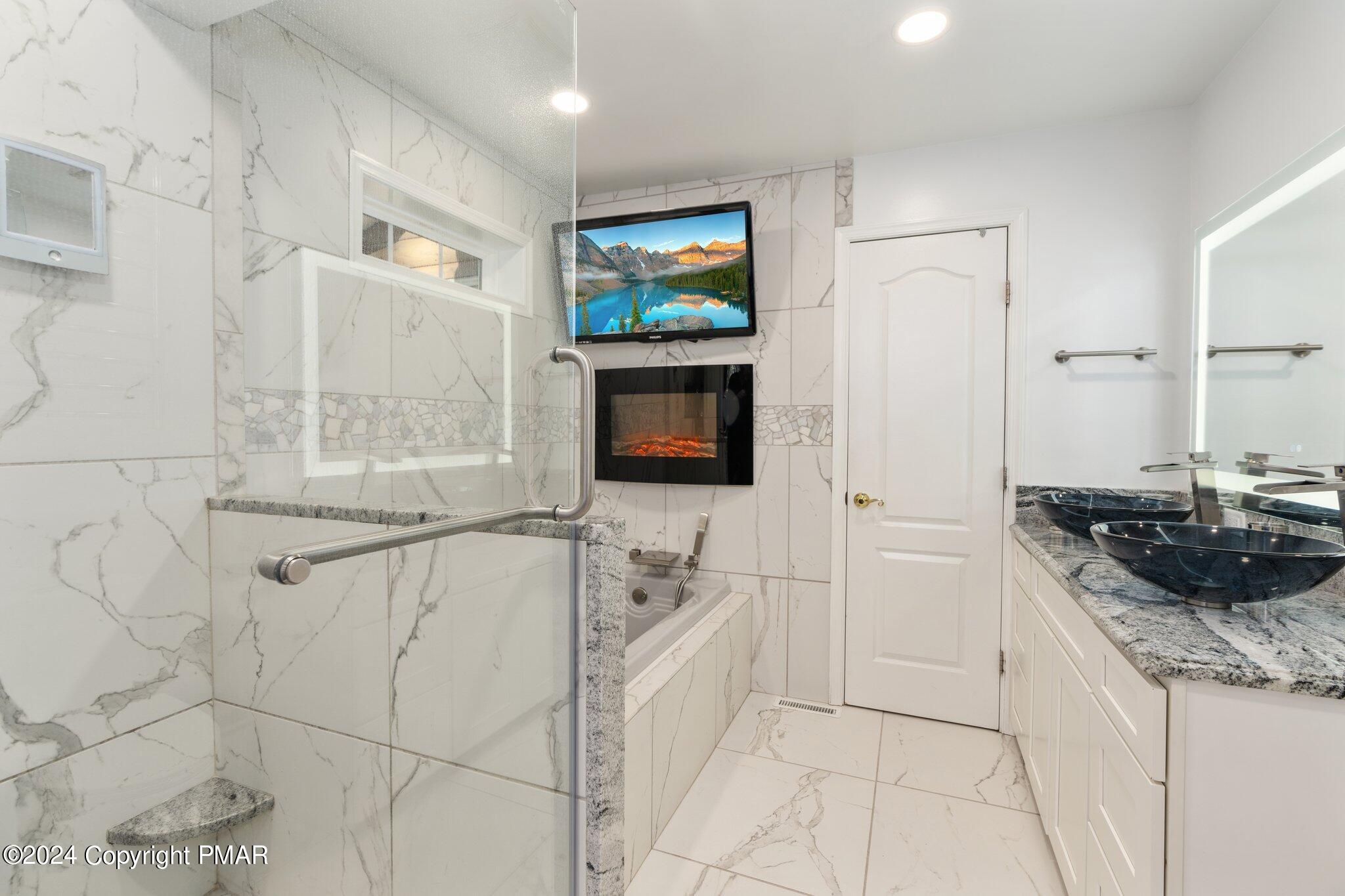 271 4 Seasons Drive Drums, PA 18222 - Photo 46 of 74 a bathroom with a sink a mirror and a shower