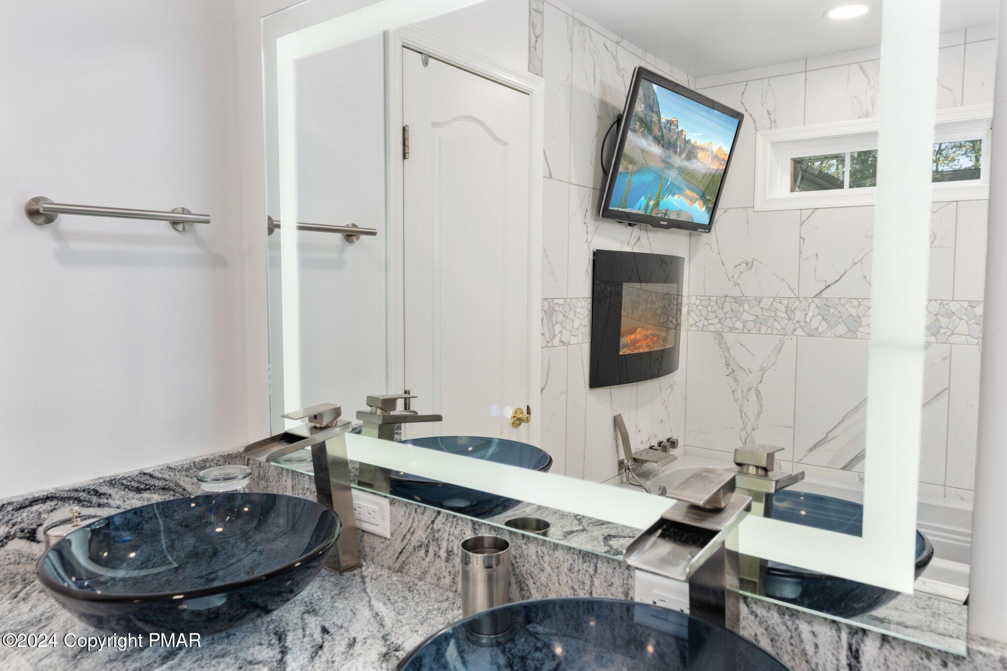 271 4 Seasons Drive Drums, PA 18222 - Photo 47 of 74 a bathroom with a sink and a mirror