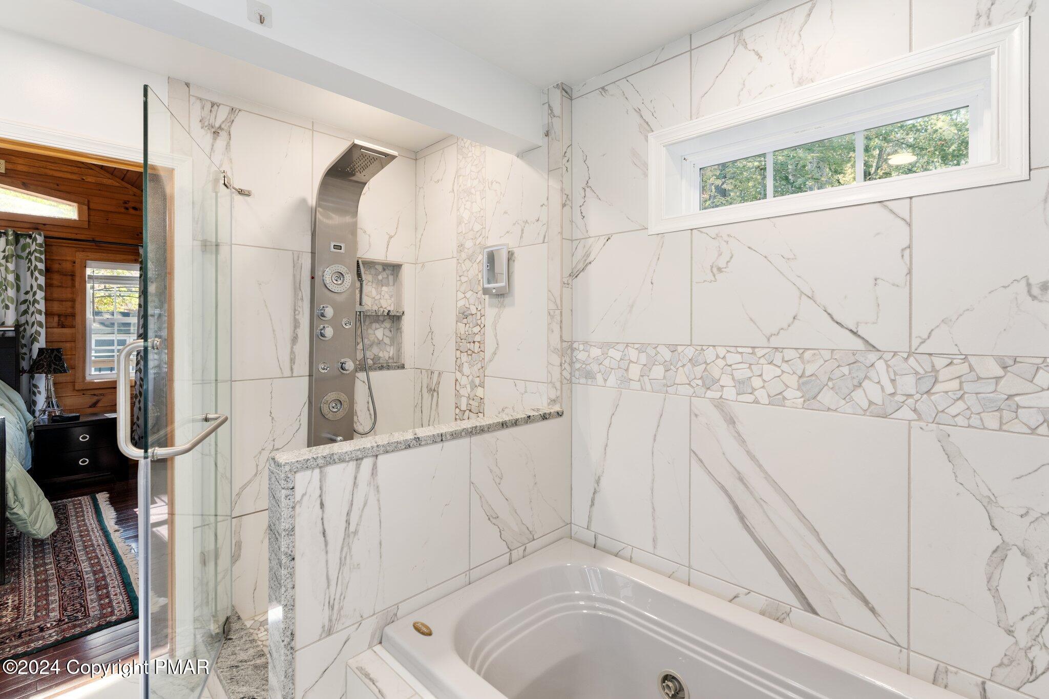 271 4 Seasons Drive Drums, PA 18222 - Photo 48 of 74 a bathroom with a bathtub and a shower