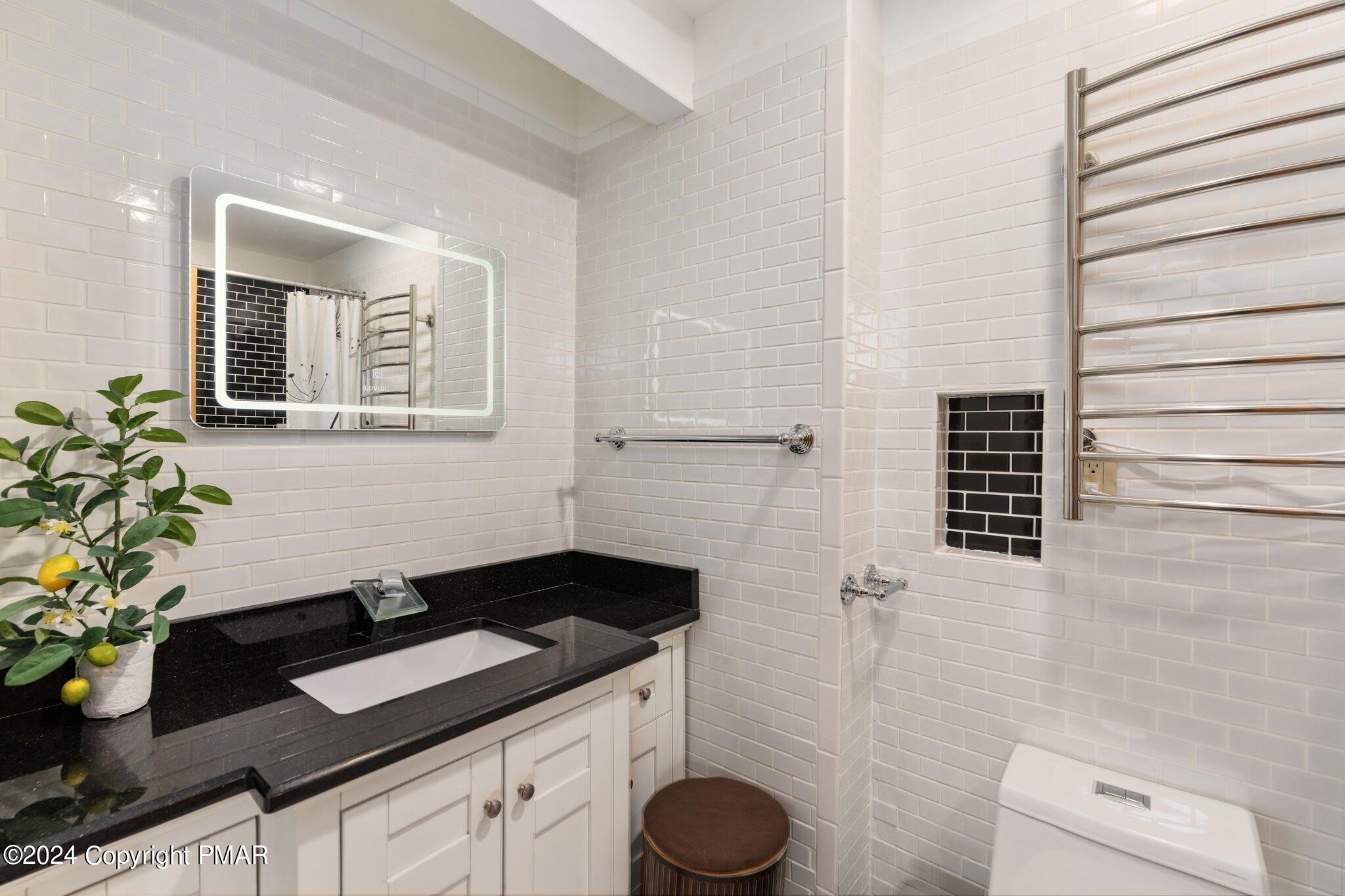 271 4 Seasons Drive Drums, PA 18222 - Photo 51 of 74 a bathroom with a granite countertop sink a toilet and mirror