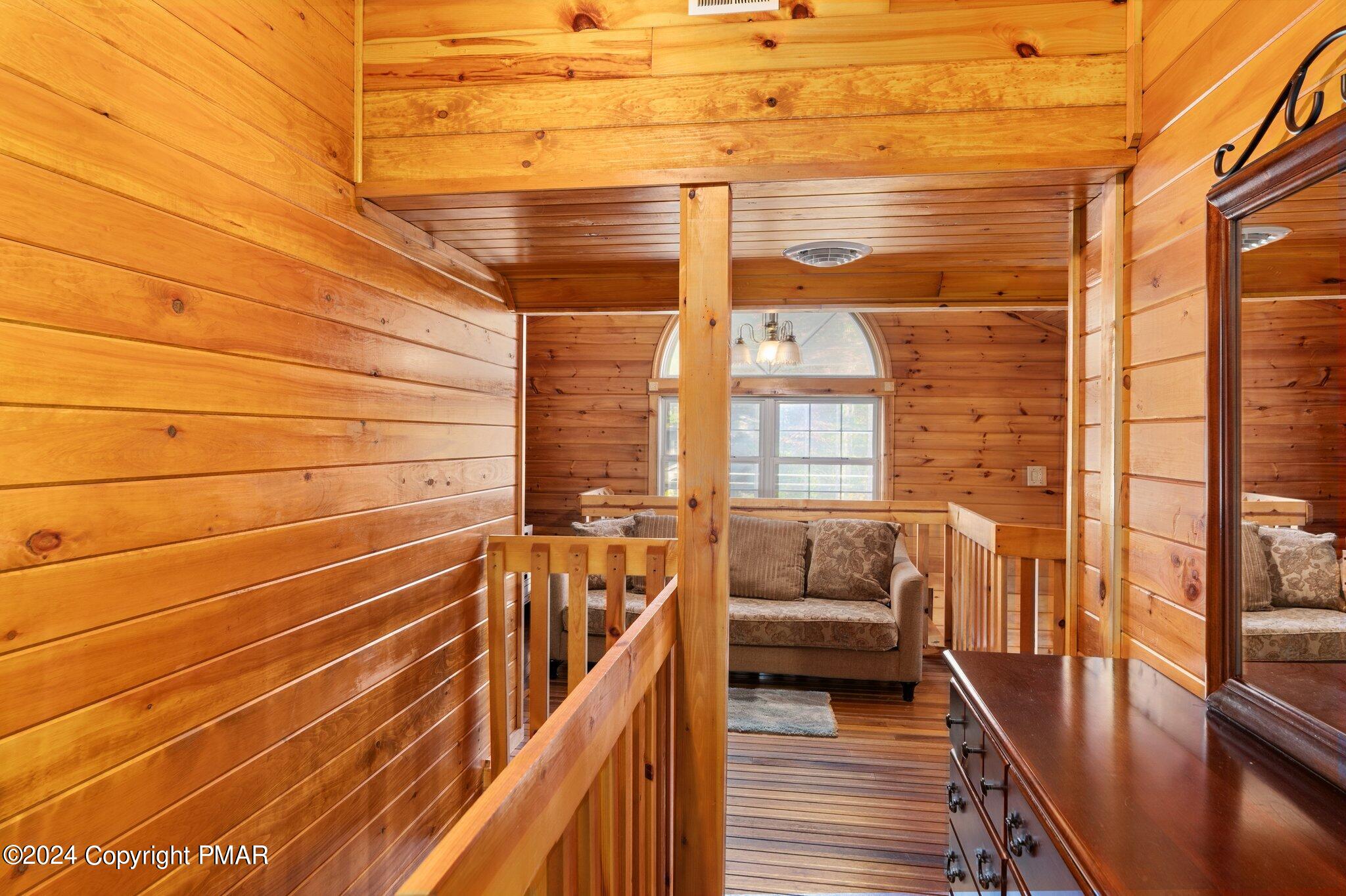 271 4 Seasons Drive Drums, PA 18222 - Photo 53 of 74 a view of a balcony with couch and wooden floor