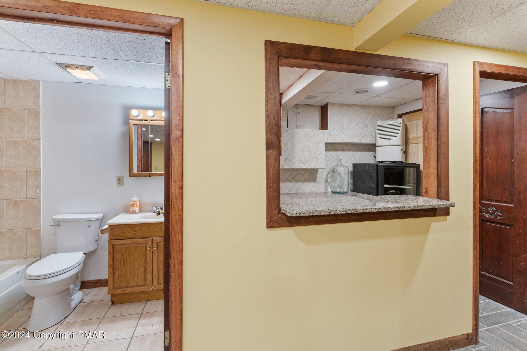 271 4 Seasons Drive Drums, PA 18222 - Photo 64 of 74 a bathroom with a toilet sink and mirror