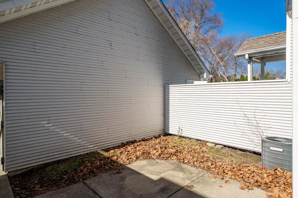 a view of a backyard with sitting area
