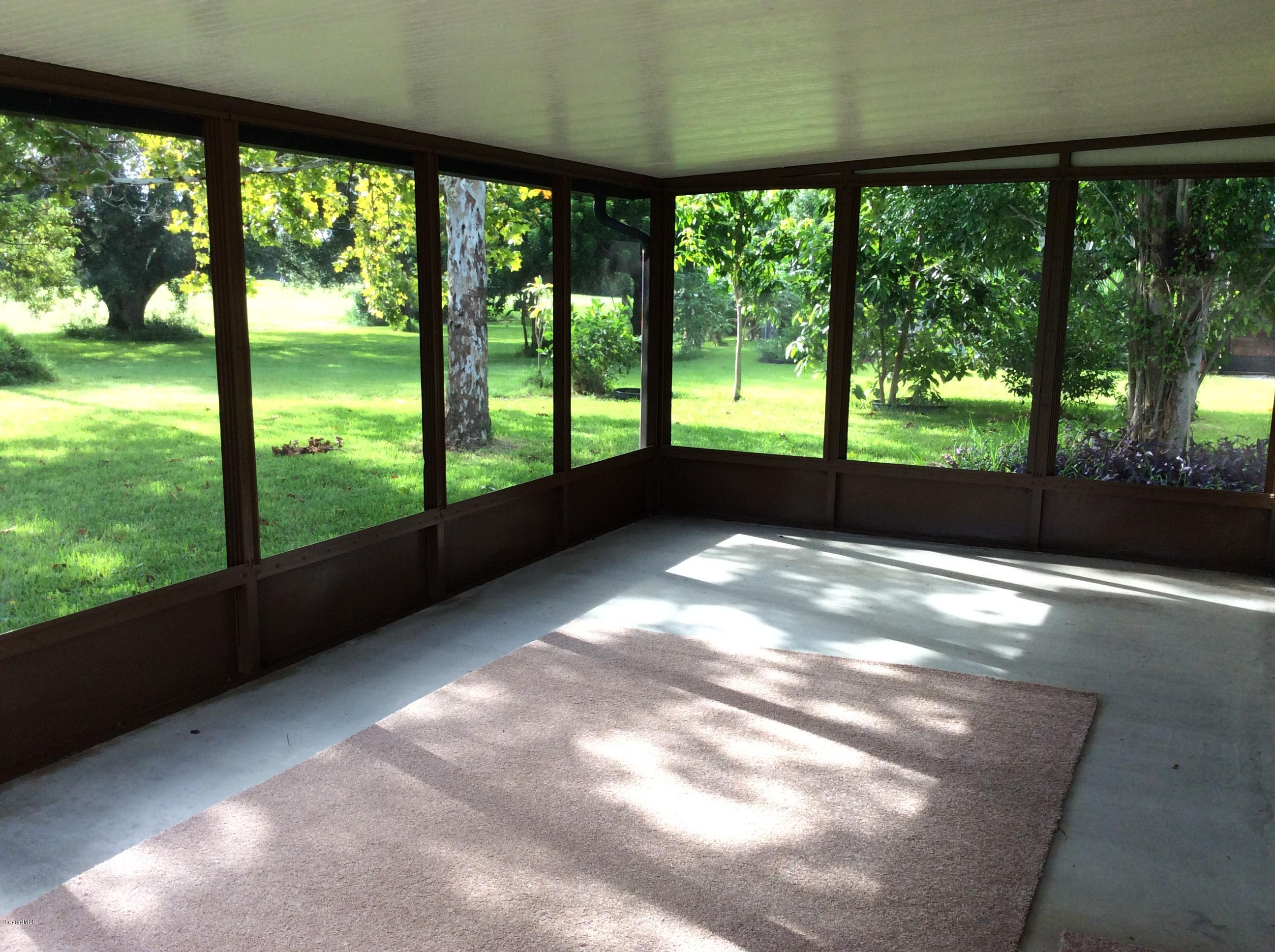 1180 Riviera Drive Northeast Palm Bay, FL 32905 - Photo 12 of 19 Screened porch