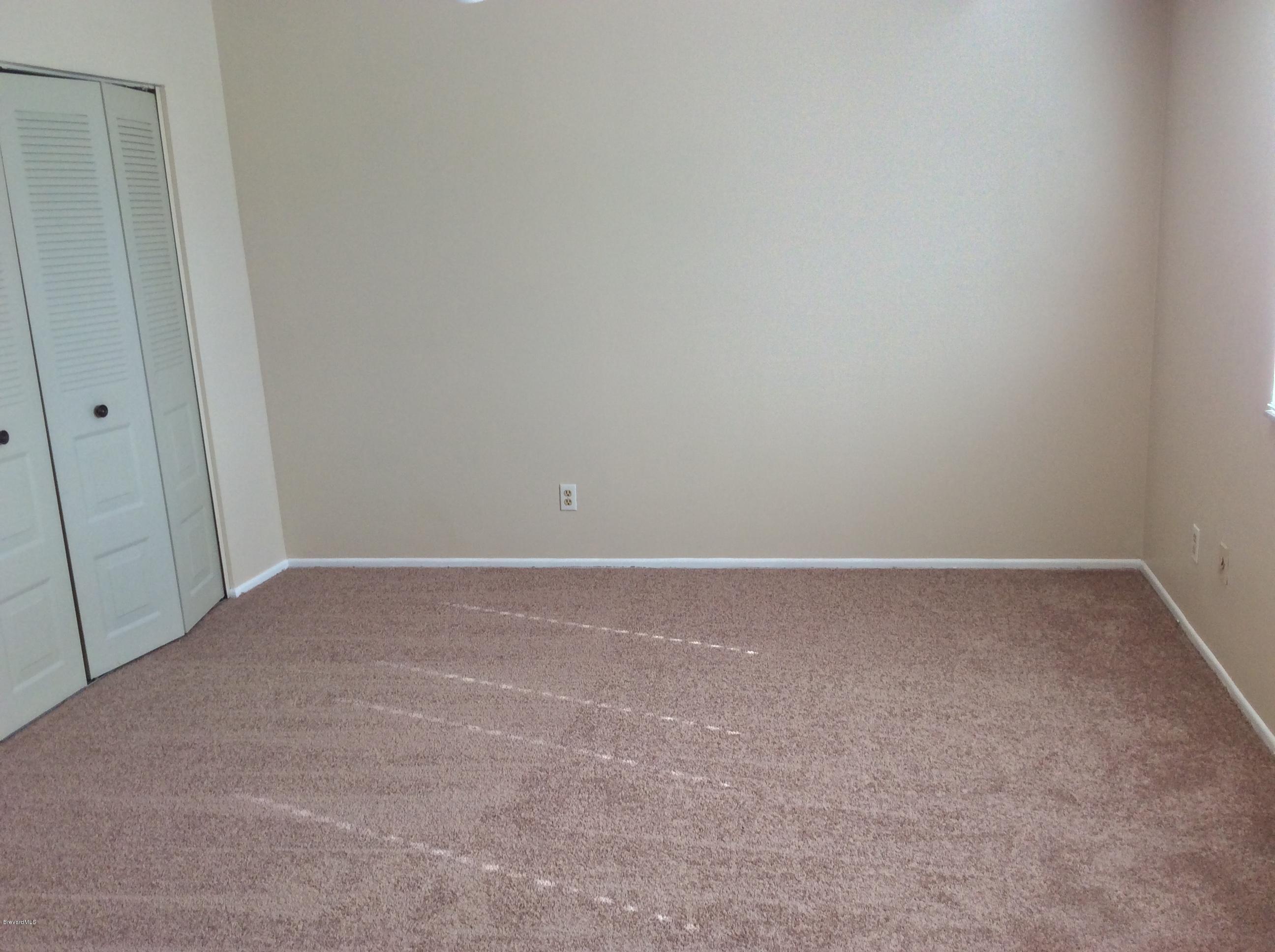 1180 Riviera Drive Northeast Palm Bay, FL 32905 - Photo 10 of 19 Master bedroom