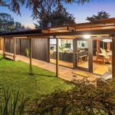 a view of house with a yard