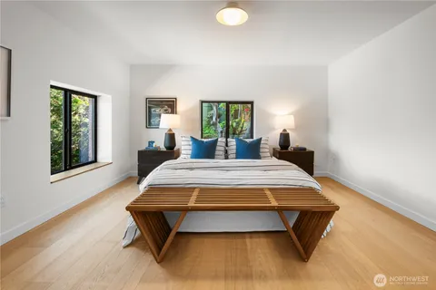a bedroom with a bed and window
