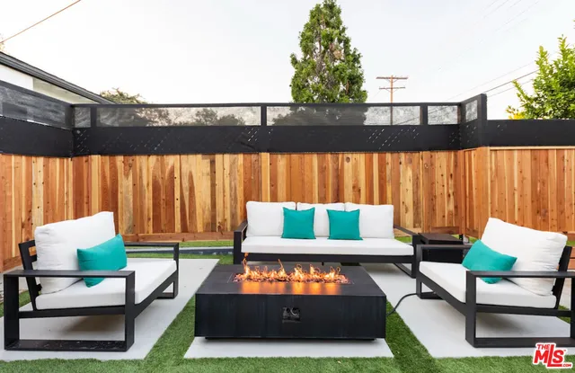 swimming pool with outdoor seating and city view