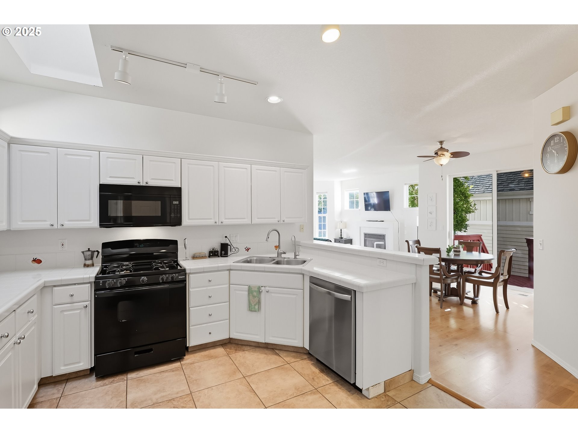 27129 Southwest Aden Avenue Wilsonville, OR 97070 - Photo 14 of 31 a kitchen with a stove a sink and cabinets