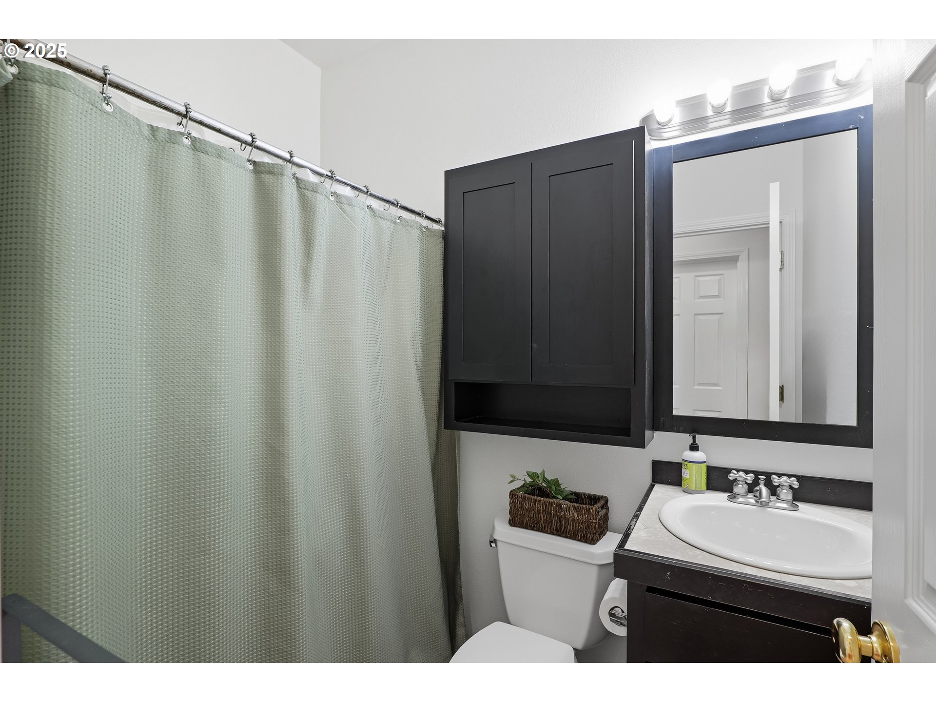 27129 Southwest Aden Avenue Wilsonville, OR 97070 - Photo 19 of 31 a bathroom with a sink and a mirror