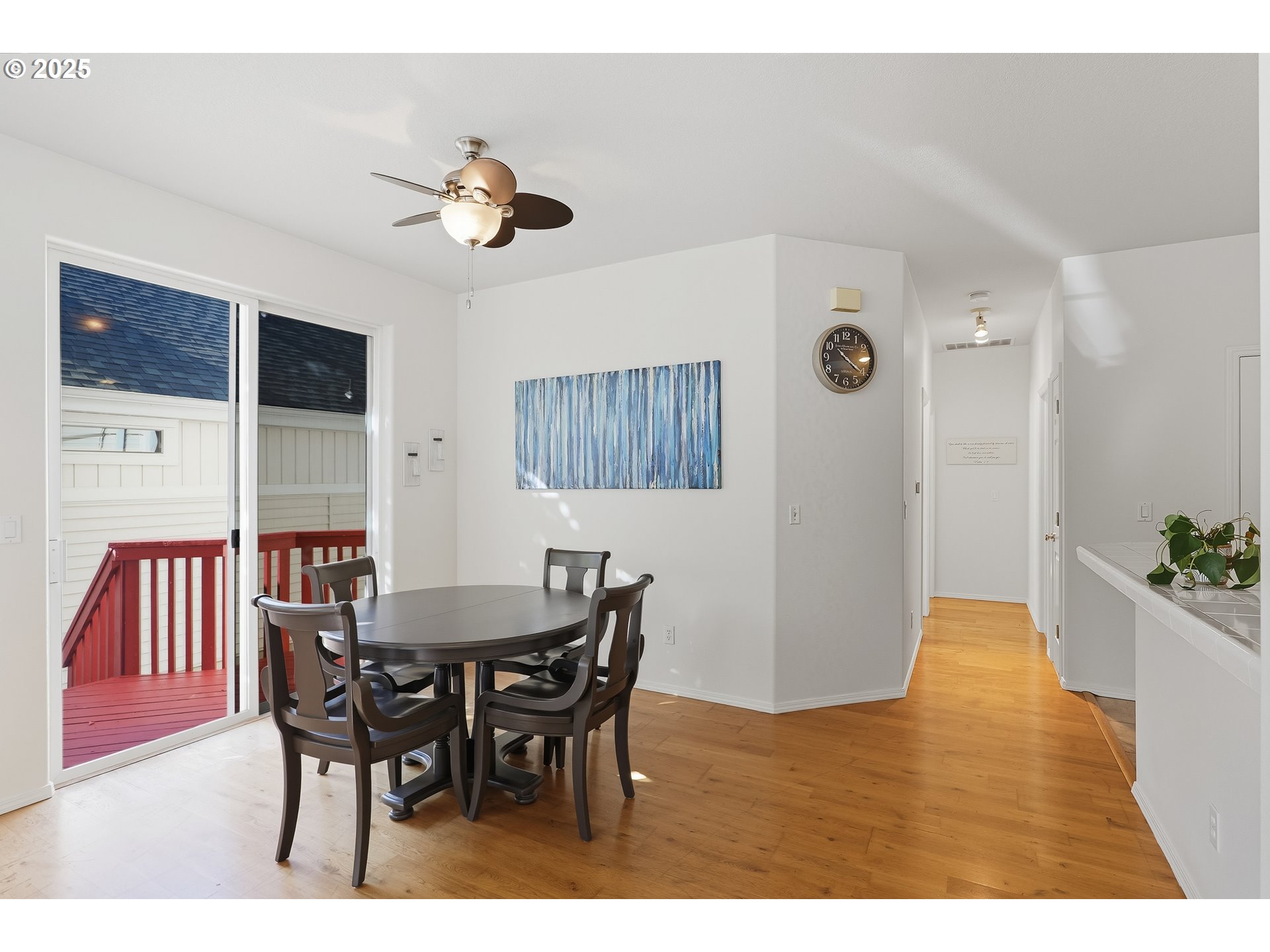 27129 Southwest Aden Avenue Wilsonville, OR 97070 - Photo 9 of 31 a view of a dining room with furniture and a chandelier