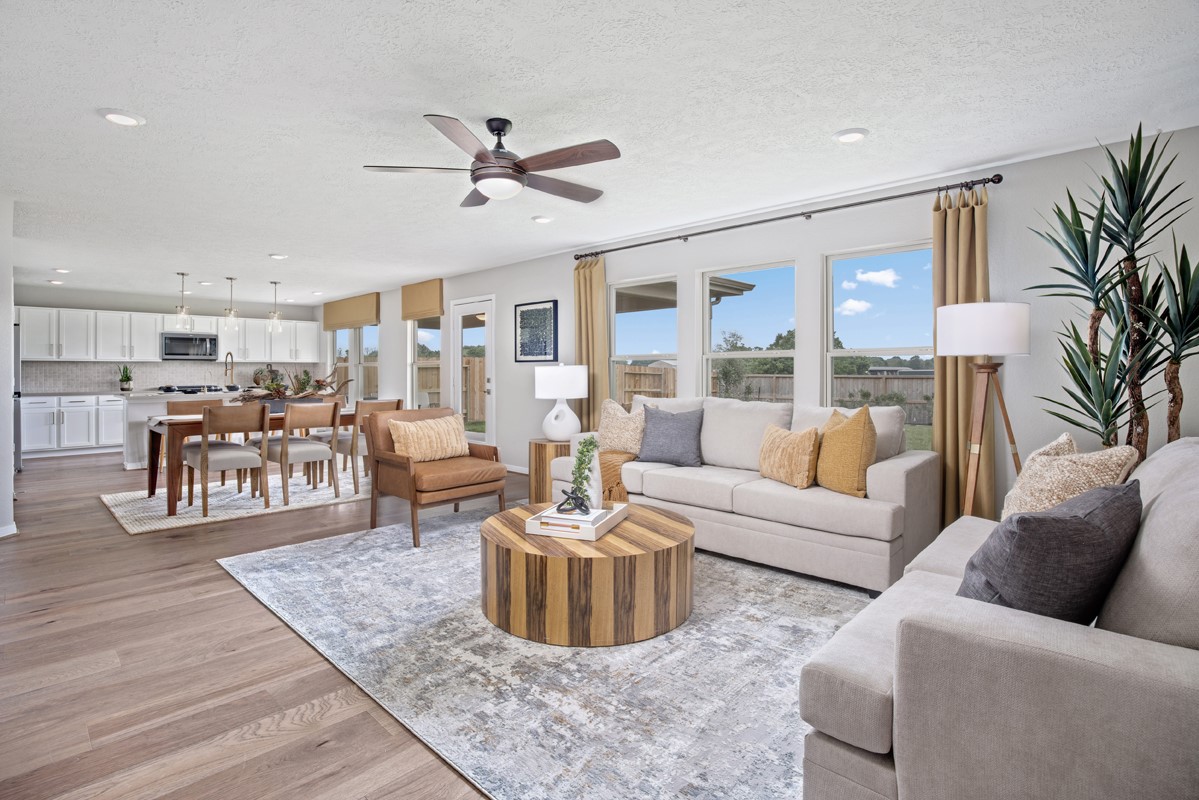 18303 Walnut Canopy Way Tomball, TX 77377 - Photo 2 of 8 a living room with furniture and a view of kitchen
