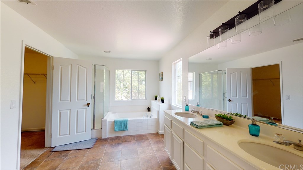 308 River Ranch Way Oceanside, CA 92057 - Photo 11 of 14 Mast Bathroom with his and hers walk in closets
