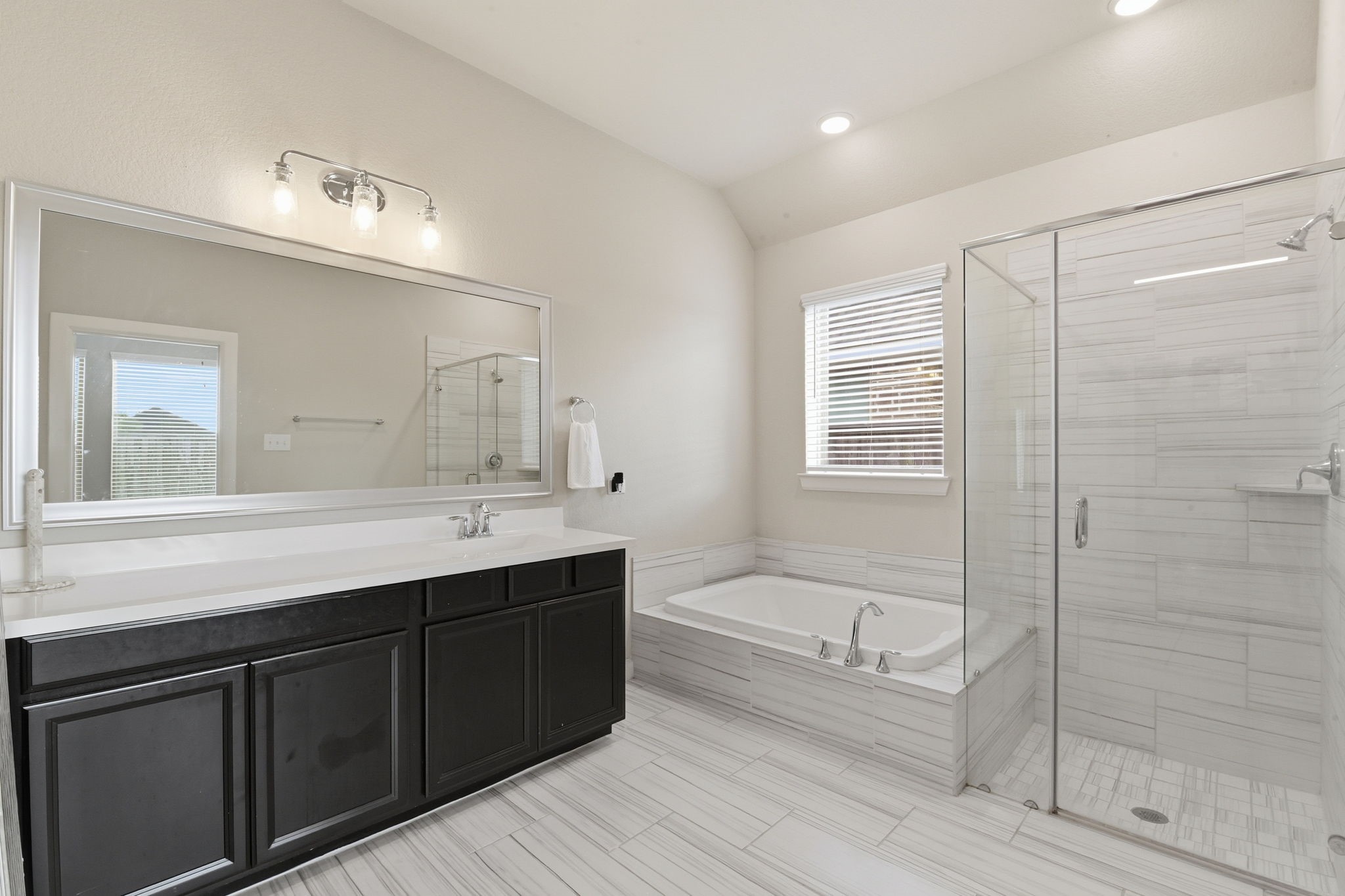 3410 Shockley Lane Rosharon, TX 77583 - Photo 17 of 29 a bathroom with a tub a sink shower and mirror