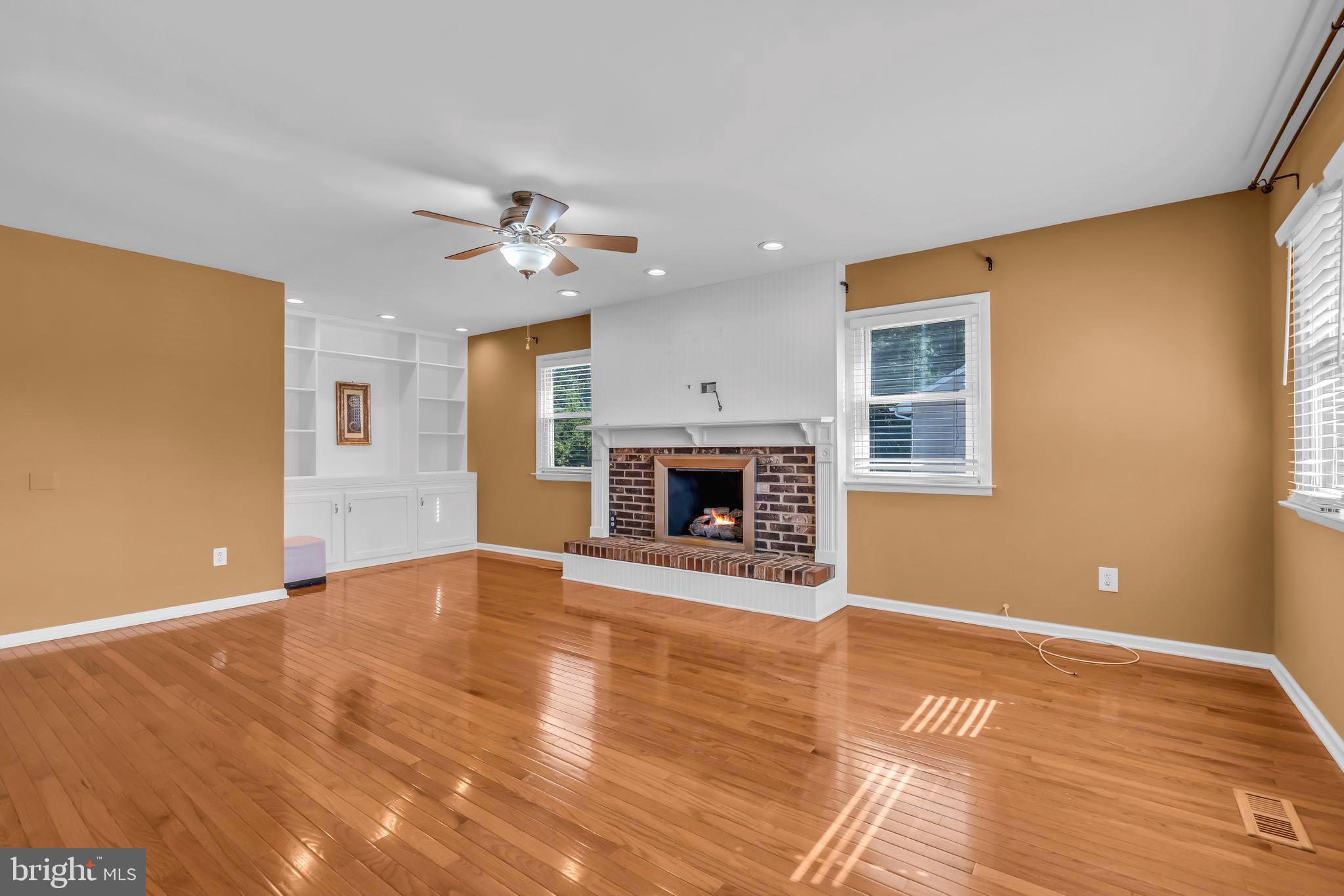 721 Rancocas Avenue Riverside, NJ 08075 - Photo 19 of 56 a view of empty room with fireplace and wooden floor