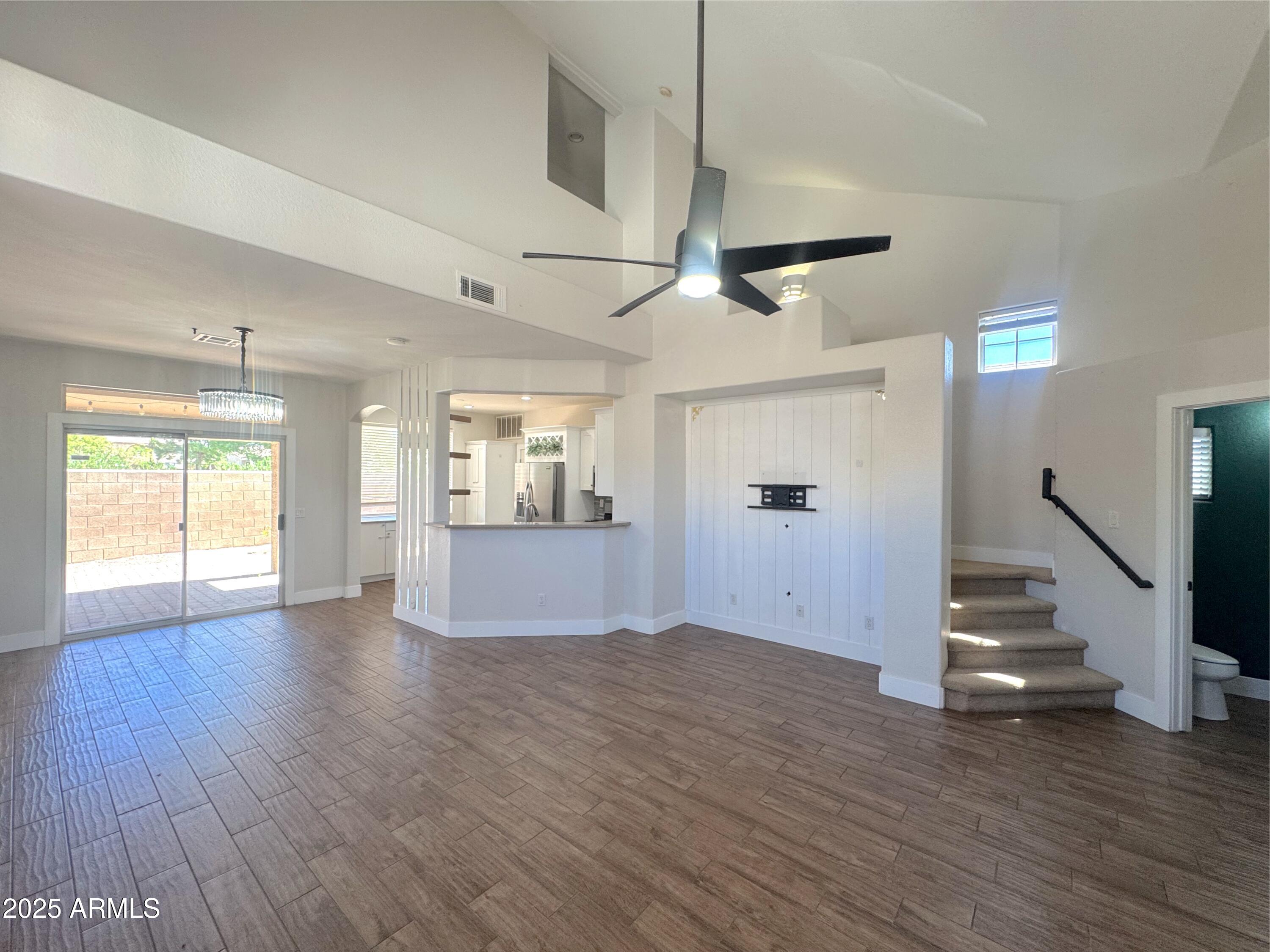 9331 East Lompoc Avenue Mesa, AZ 85209 - Photo 2 of 15 a view of an empty room with wooden floor and a window
